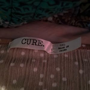 Green and white polka dot 3XL shirt from CURE